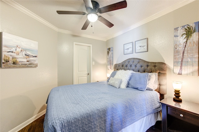 bedroom featuring crown molding, dark wood-type flooring, and ceiling fan