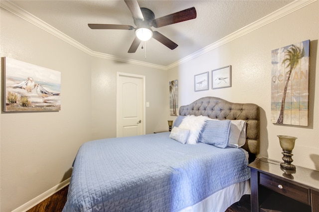 bedroom featuring ceiling fan, crown molding, and wood-type flooring