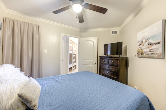 bedroom with crown molding, a textured ceiling, and ceiling fan