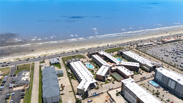 drone / aerial view with a water view and a view of the beach