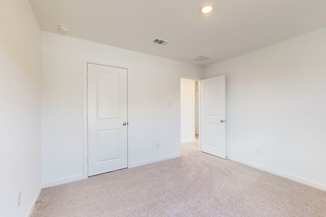 unfurnished bedroom with light carpet