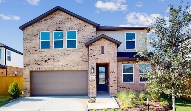 view of front of home with an attached garage, fence, concrete driveway, and brick siding