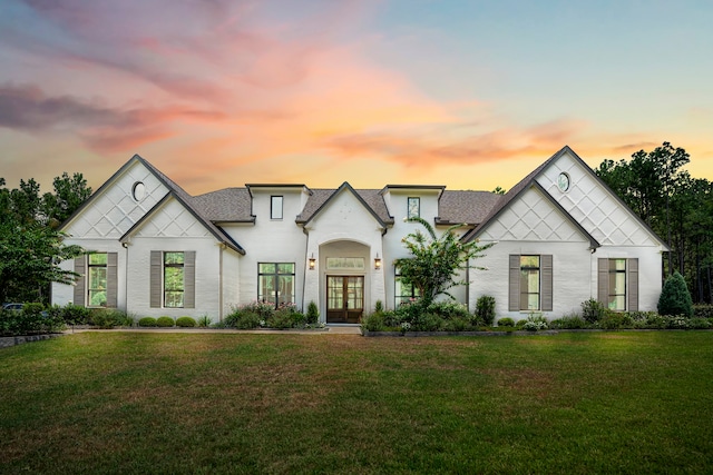 view of front of property with a yard