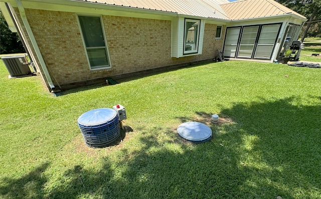 view of yard featuring central AC unit