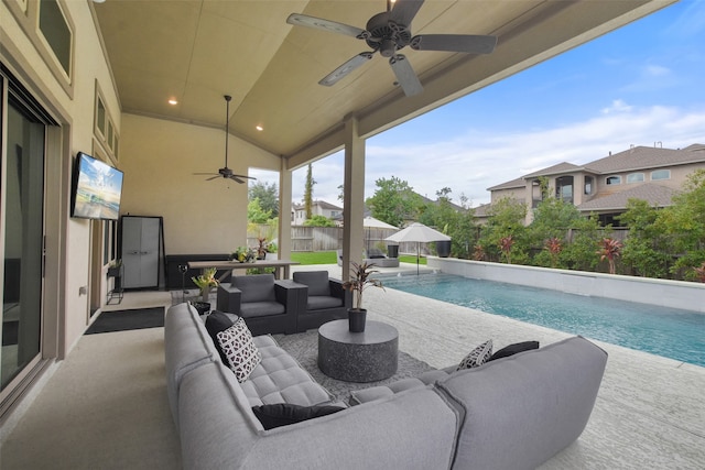 view of patio featuring ceiling fan, a fenced in pool, and an outdoor living space