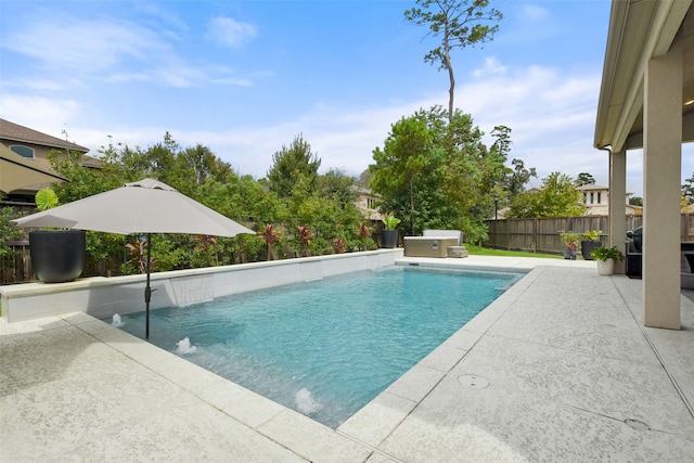 view of swimming pool with a patio area and pool water feature