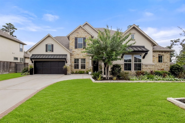 view of front of property featuring a garage and a front yard