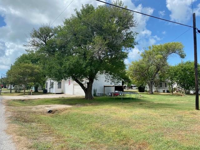 view of yard featuring a garage