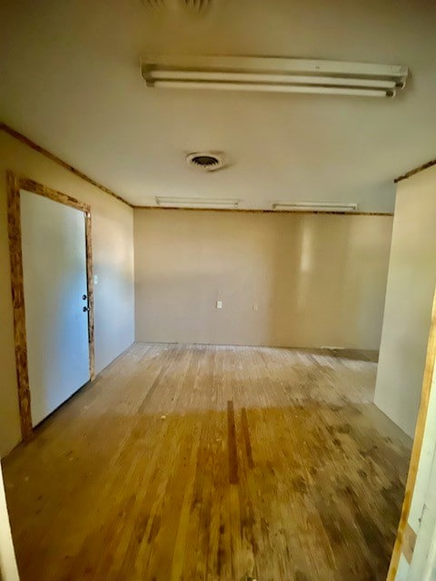 empty room featuring hardwood / wood-style flooring