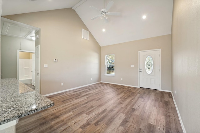 foyer entrance featuring ceiling fan, high vaulted ceiling, and hardwood / wood-style floors