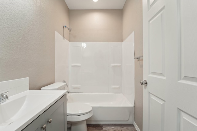 full bathroom featuring vanity, shower / bathing tub combination, wood-type flooring, and toilet