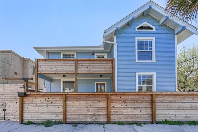 view of front of house featuring a balcony