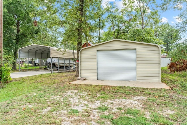 garage featuring a lawn and a carport