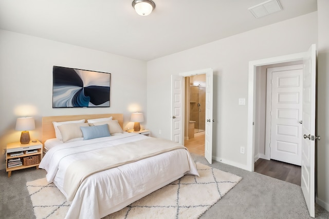 bedroom with carpet and ensuite bathroom