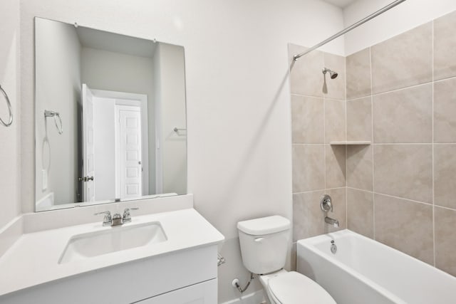 full bathroom featuring vanity, toilet, and tiled shower / bath