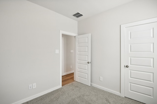 unfurnished bedroom with carpet