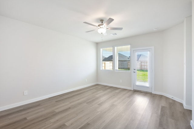 unfurnished room featuring light hardwood / wood-style flooring and ceiling fan