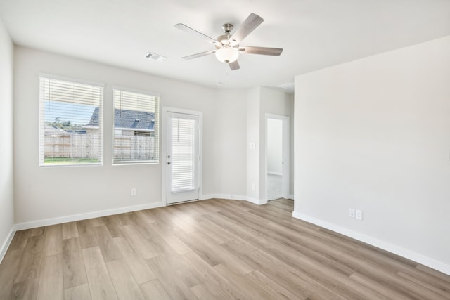 unfurnished room featuring light hardwood / wood-style floors and ceiling fan