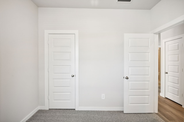 unfurnished bedroom featuring wood-type flooring