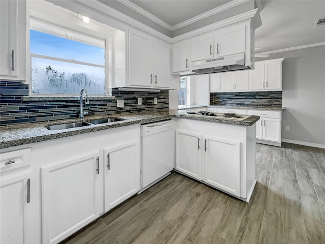 kitchen featuring stone counters, white cabinetry, white appliances, light hardwood / wood-style flooring, and sink