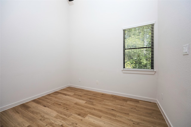 empty room with light hardwood / wood-style floors