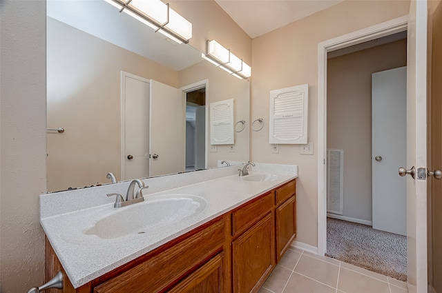 bathroom with tile patterned floors and vanity