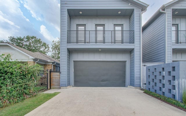 view of front facade featuring a balcony and a garage