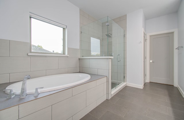 bathroom with tile patterned flooring and plus walk in shower