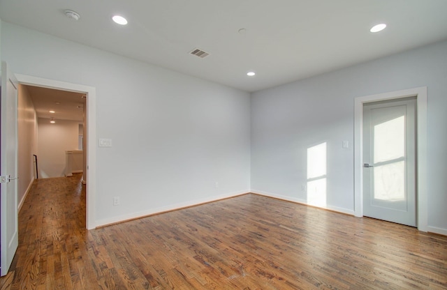 empty room featuring dark wood-type flooring