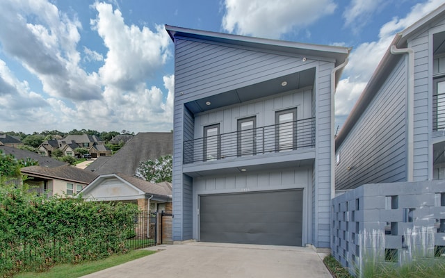 view of front of home with a balcony and a garage