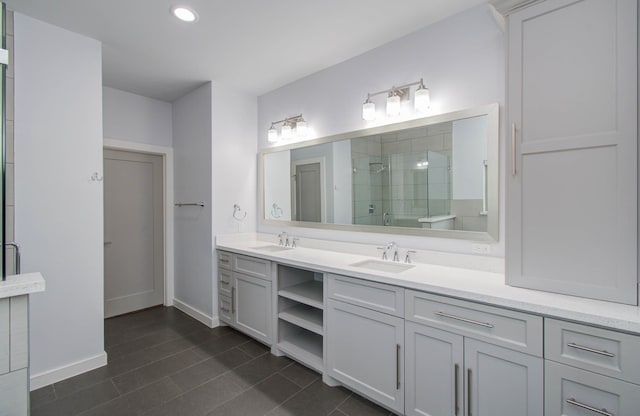 bathroom featuring vanity and an enclosed shower