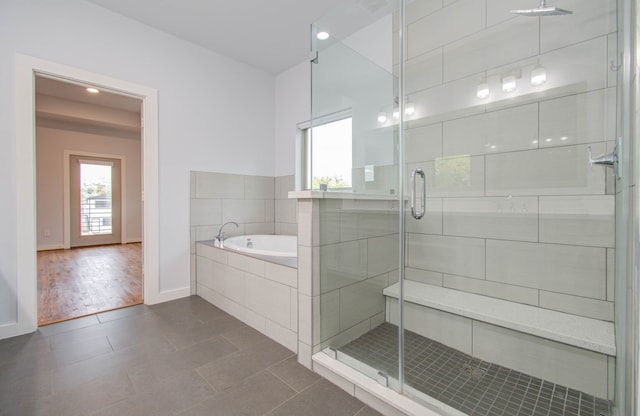 bathroom with hardwood / wood-style flooring and plus walk in shower