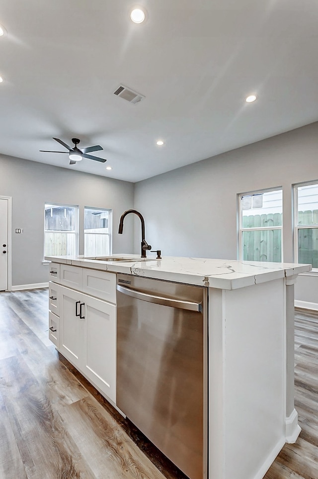 kitchen featuring white cabinetry, sink, ceiling fan, a kitchen island with sink, and stainless steel dishwasher