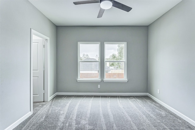 carpeted empty room with ceiling fan