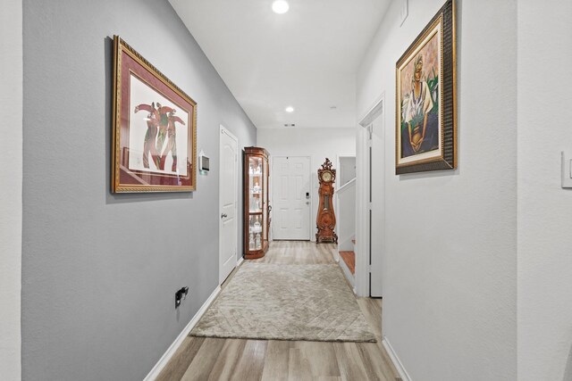 hallway featuring light wood-type flooring