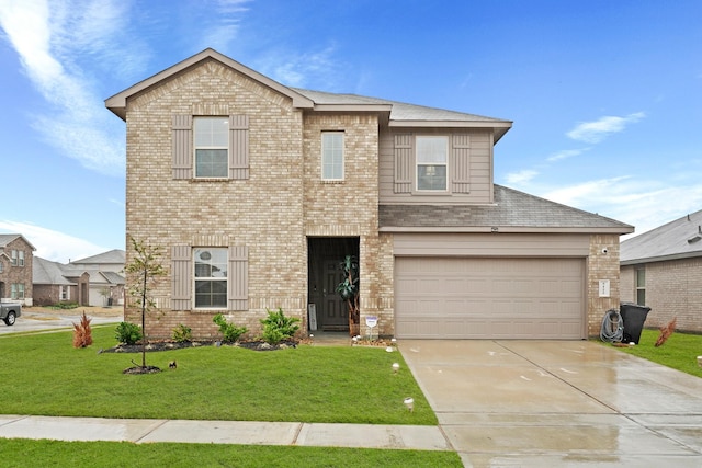 view of front facade featuring a garage, driveway, brick siding, and a front lawn