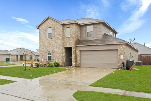 view of front of house featuring a garage, central AC unit, and a front yard