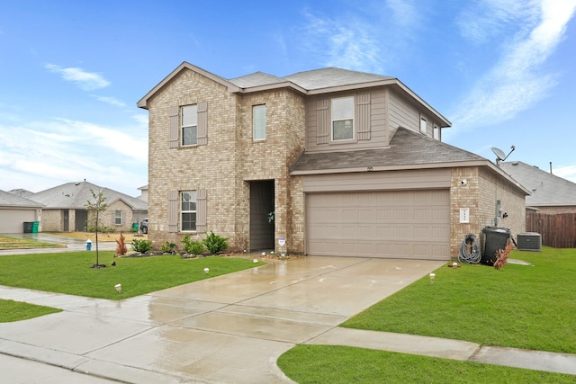 view of front of home featuring central air condition unit, concrete driveway, an attached garage, a front yard, and brick siding