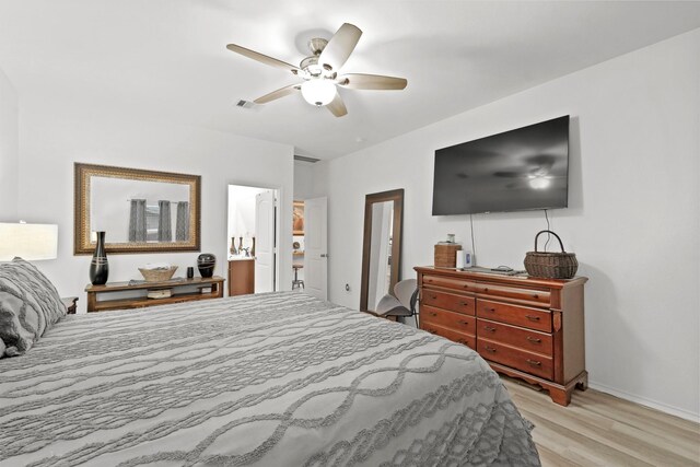 bedroom featuring light hardwood / wood-style flooring and ceiling fan