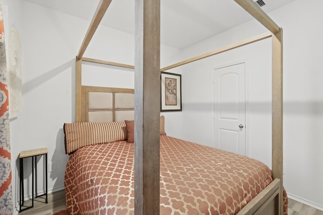 bedroom with light hardwood / wood-style floors