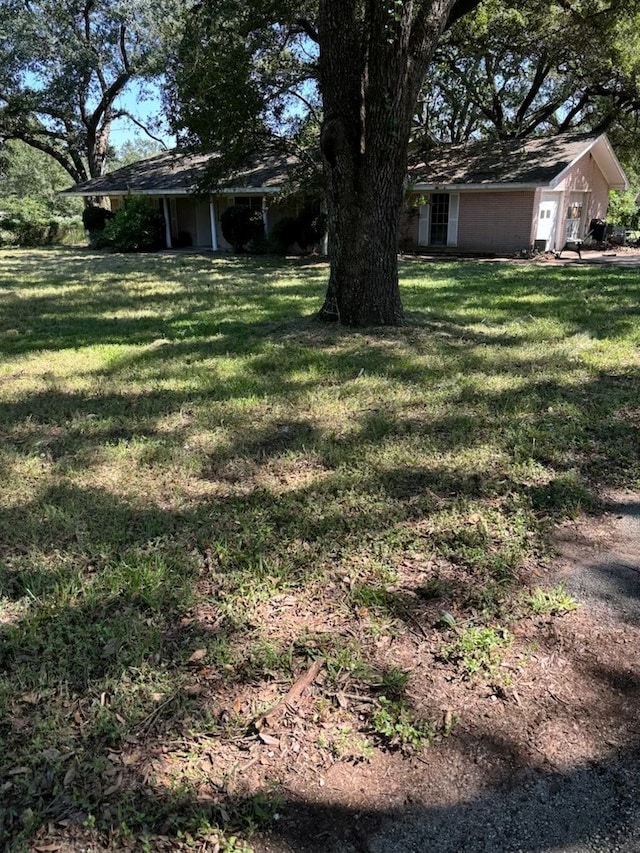 view of yard featuring a garage