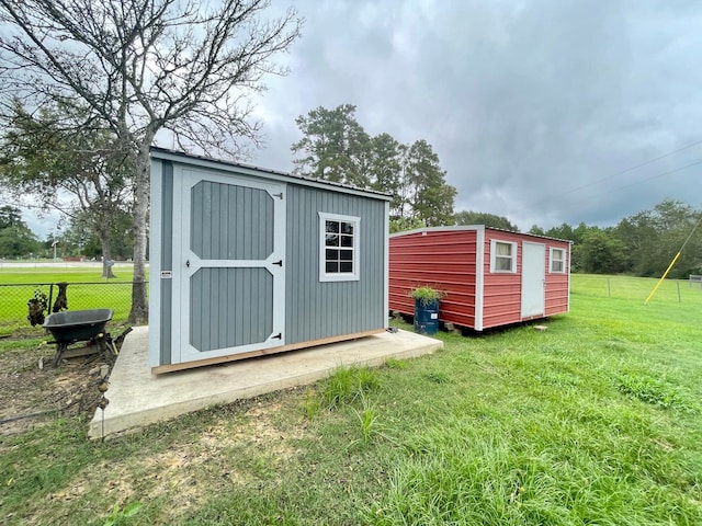 view of outbuilding featuring a lawn