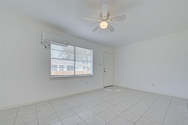 spare room featuring ceiling fan, light tile patterned floors, and an AC wall unit