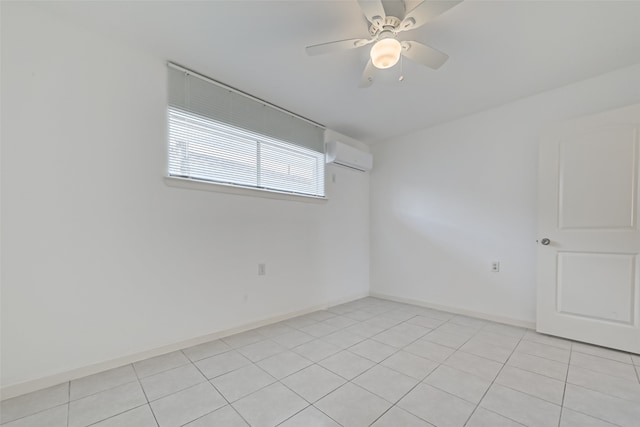 tiled spare room with ceiling fan and a wall mounted air conditioner