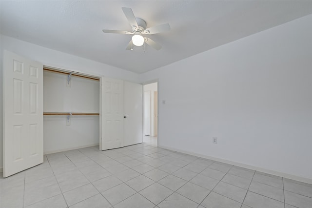 unfurnished bedroom with a closet, ceiling fan, and light tile patterned floors