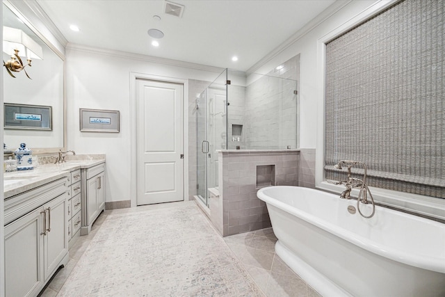 full bath featuring double vanity, a soaking tub, visible vents, ornamental molding, and a stall shower