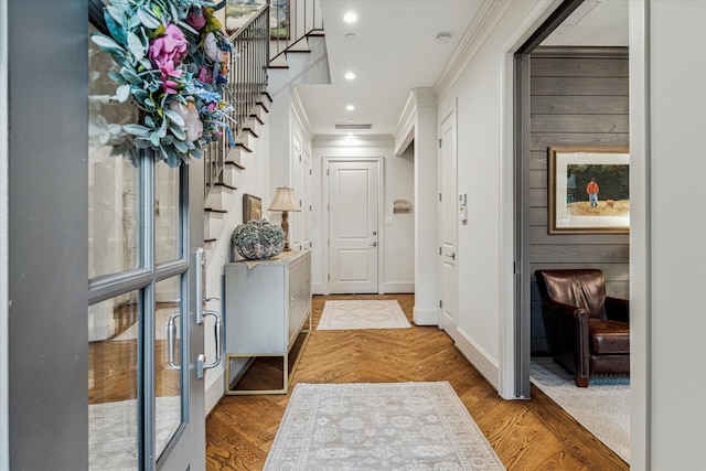 interior space featuring ornamental molding, recessed lighting, stairway, and light wood finished floors