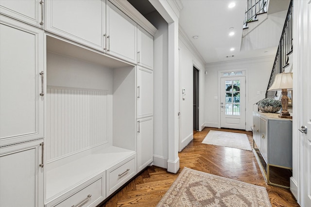 mudroom with baseboards, recessed lighting, and crown molding