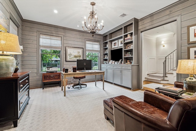 office area with a chandelier, wooden walls, light colored carpet, visible vents, and built in features