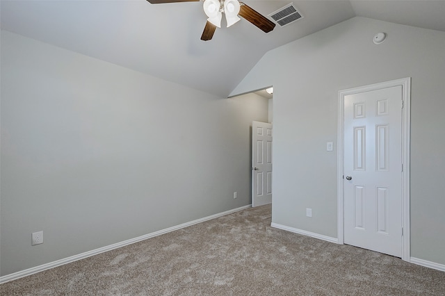 unfurnished bedroom featuring vaulted ceiling, light carpet, and ceiling fan